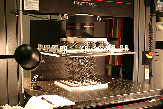 In the lab, a sample of the cellular composite material is prepared for testing of its strength properties.